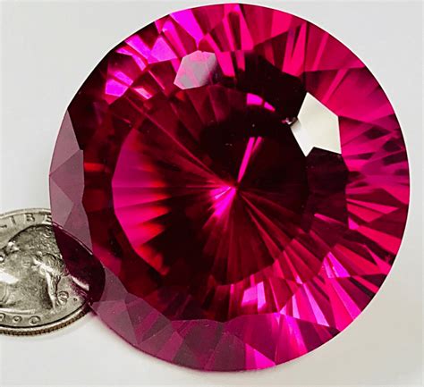 Product description. One beautiful transparent AGL certified Red 7.04 carat oval shape red ruby with dimensions of 12.76 x 10.74 x 6.04 mm. It has a mixed brilliant cut, and a clarity grade of very slightly included (evaluated at eye level), vivid color intensity, and an excellent polish. The origin of this ruby is Burma (Myanmar).